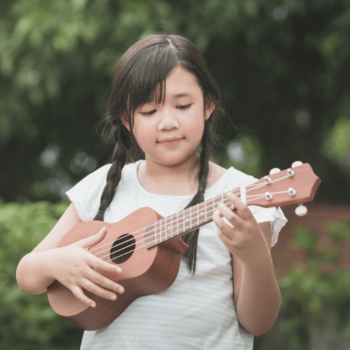 A young girl playing the ukulele | Ukulele lessons near Chafford Hundred